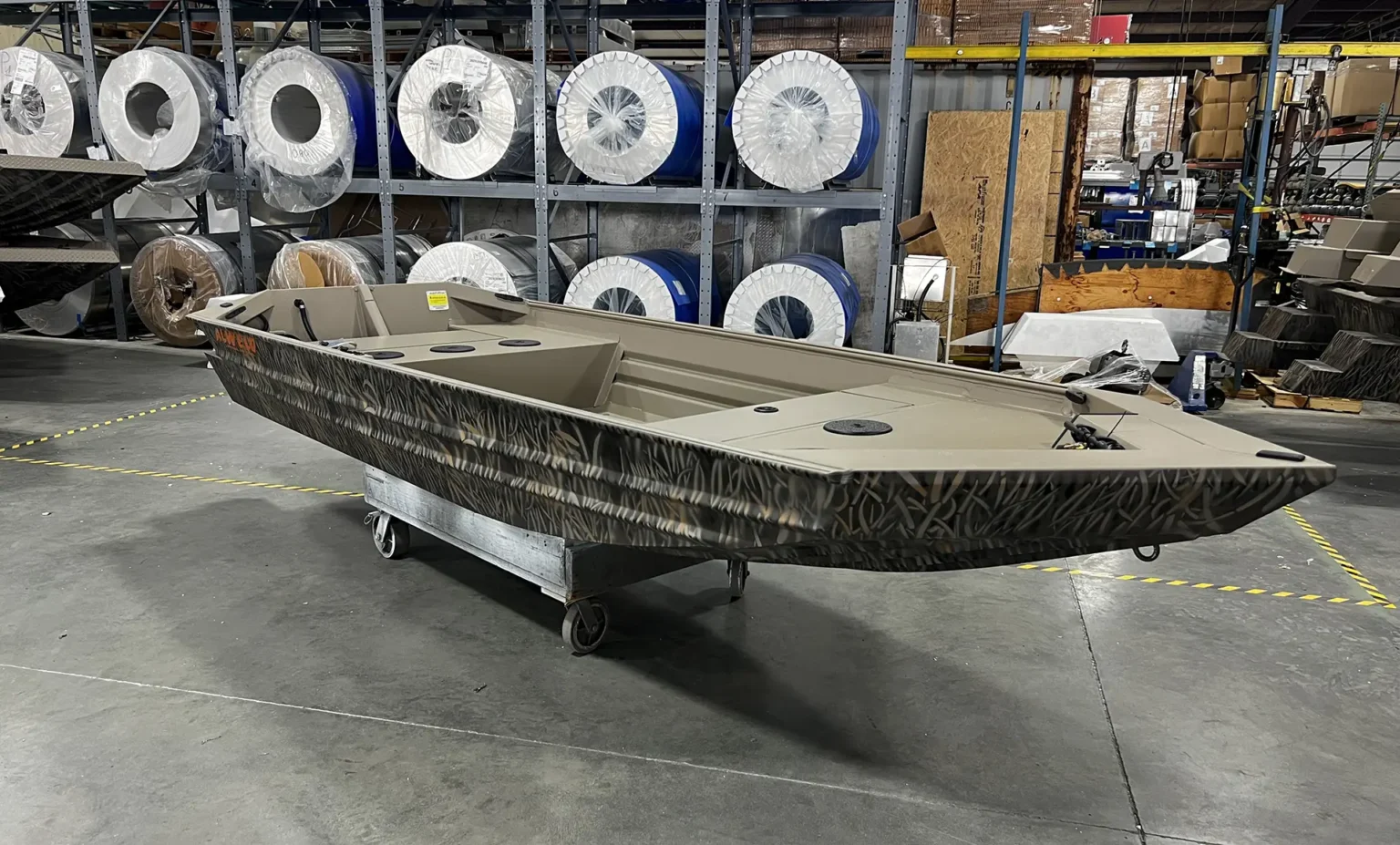 Marsh Tiller Series boat in the warehouse