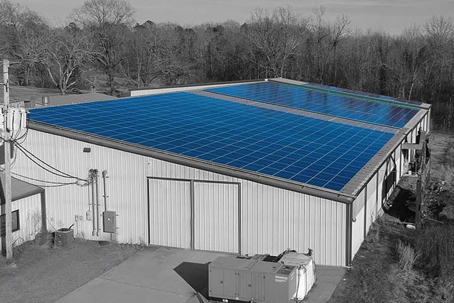 An Alweld building with solar panels on the roof