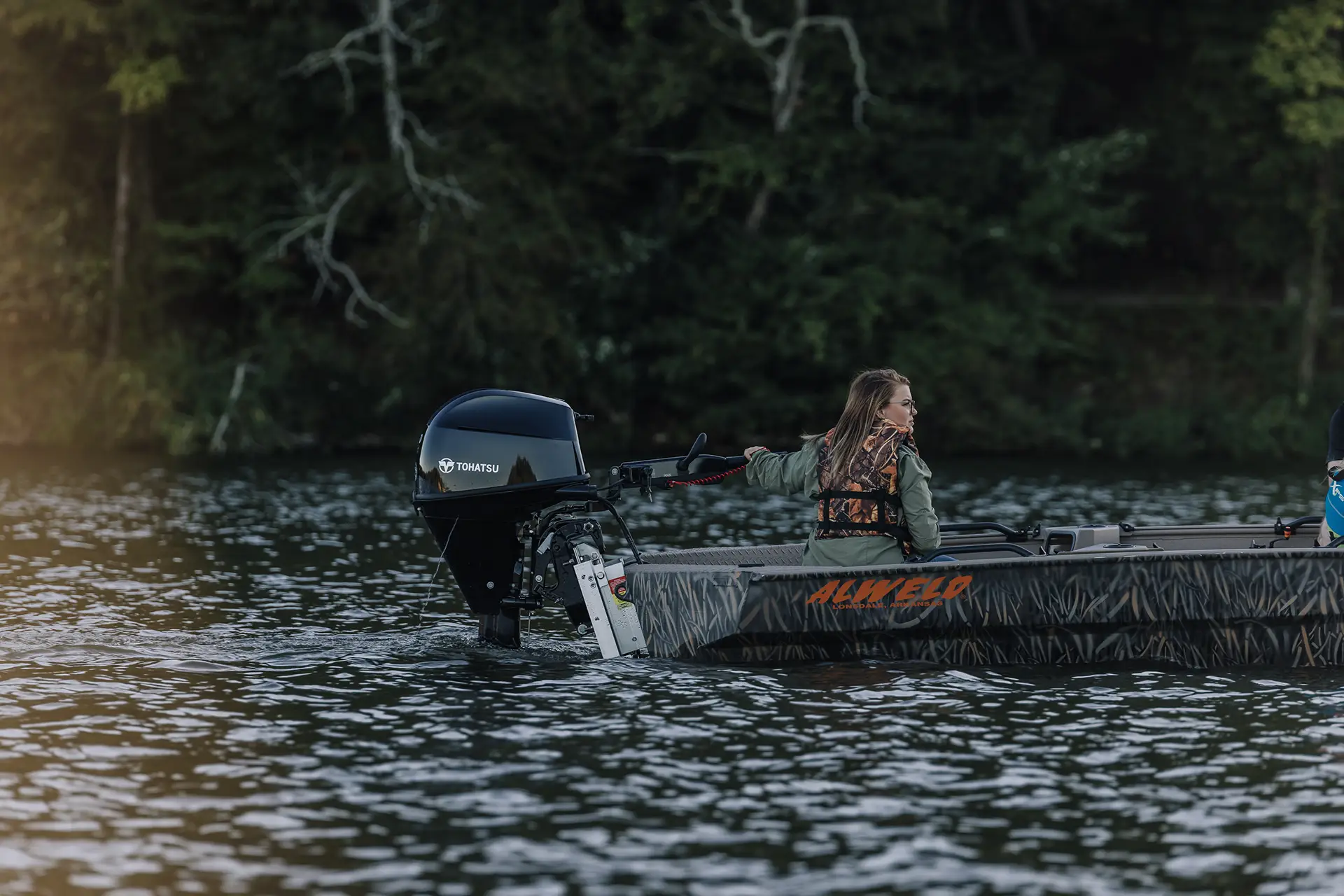 A family in their Alweld boat on the water