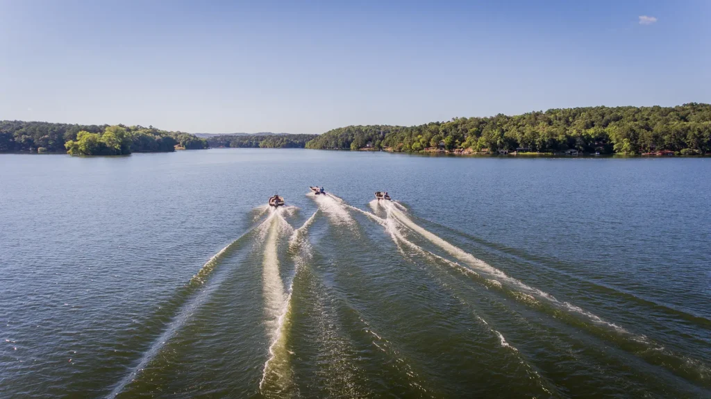 Three Alweld boats cruising on the water